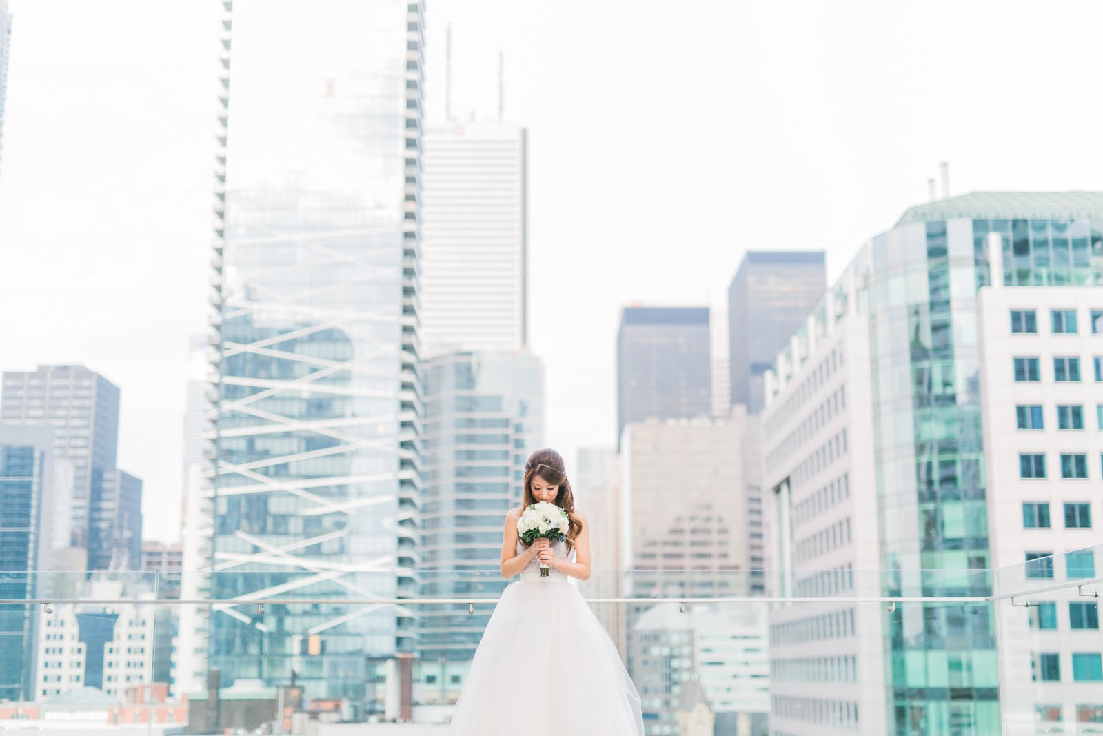 Bride & Bouquet & City View